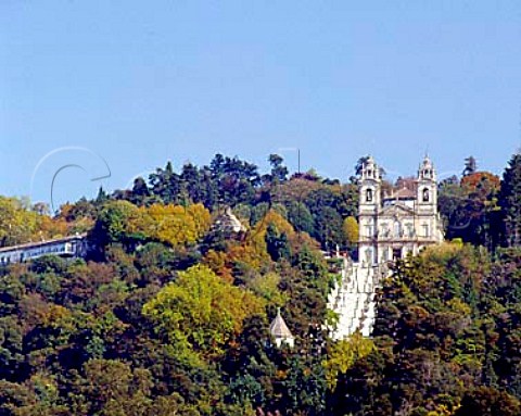 The church of Bom Jesus do Monte situated at the topof its vast ornamental staircase of white plasterand granite Cut into the side of a densely woodedhill high above the city of Braga it was created atthe beginning of the 18thcentury by Bragasarchbishop It is now a place of pilgrimage  Braga Portugal
