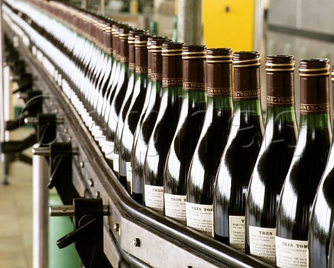 Bottles of Tres Torres on the bottling line of the    Torres winery Pacs del Penedes Catalonia Spain
