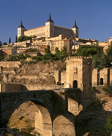 The 10thcentury Puente de Alcantara over the Tajo River with the Alcazar above   Toledo CastillaLa Mancha Spain