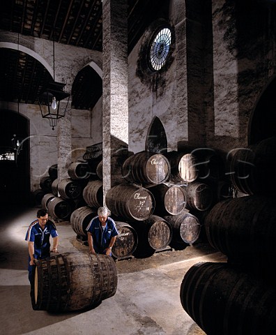 Rolling barrel of sherry through Osbornes   La Palma bodega Puerto de Santa Maria   Andaluca Spain          Sherry