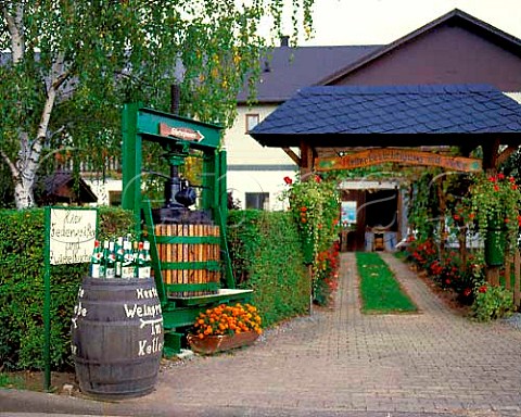 Display of bottles and barrel advertising tastings   outside a small Winery in Piesport Mosel