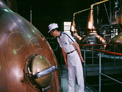 Looking through the spyhole of one of the six wash stills at Suntory Hakushu Distillery Yamanashi Prefecture Japan