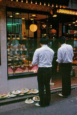 Tokyo  Japan Arranging a display of   plastic food in a restaurant window