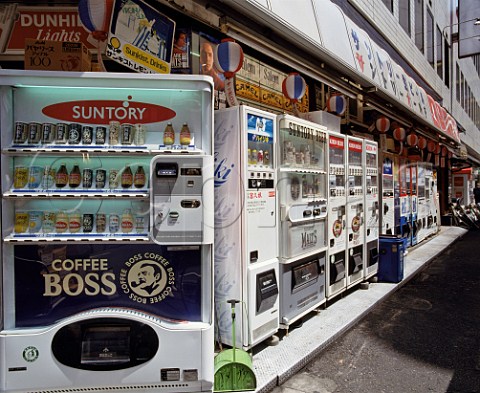 Vending machines selling coffee and beer outside a liquor shop in Shinjuku district  Tokyo Japan
