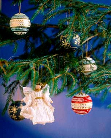 Paper decorations hanging from a traditional  Norwegian Spruce Christmas tree