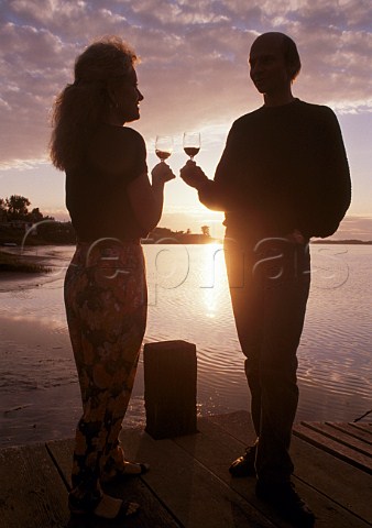 Couple enjoying wine at sunset Morro Bay California