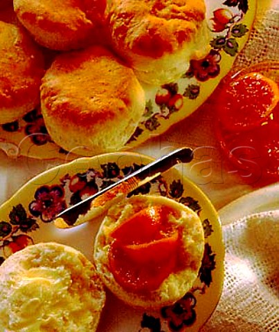 Scones with butter and preserved orange slices