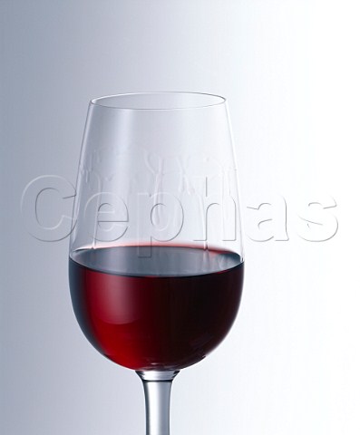 Glass of red wine showing the legs on the side of   the glass