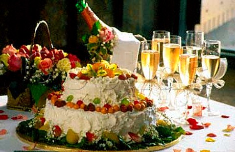Wedding cake with bottle and glasses of   Champagne