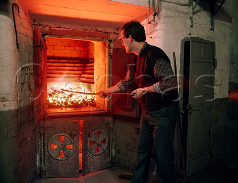 Raking kiln fire at Balvenie Distillery Dufftown   Scotland