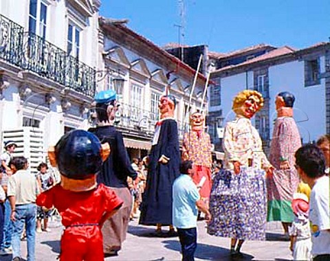Parade of giant clowns during the Festival of Our   Lady of Sorrows Viano do Castelo Minho Portugal