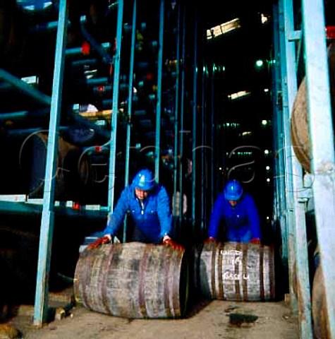 Rolling casks through warehouse at Tomatin   Distillery Tomatin Invernessshire