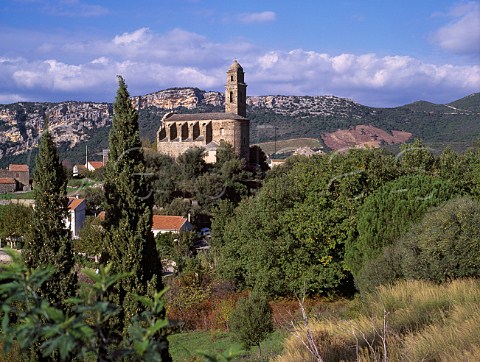 The church of Patrimonio with vineyards on the  hillside beyond HauteCorse Corsica