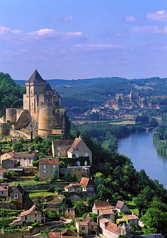 Castelnaud chteau and village above the   Dordogne River with Beynac in the   distance   Dordogne France