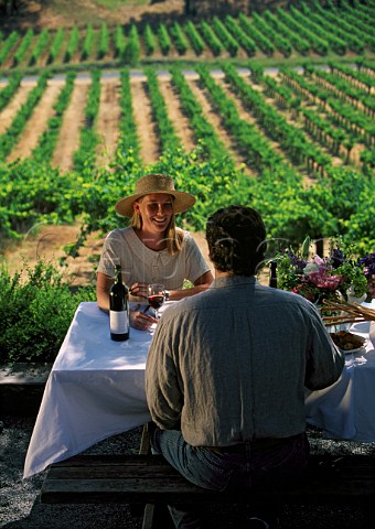 Couple dining on the terrace of Joseph Phelps Winery St Helena Napa Valley California
