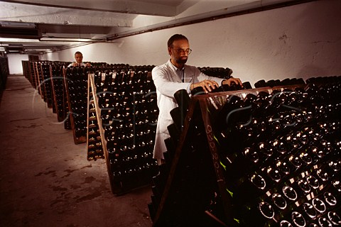 Performing the remuage on bottles of   Prosecco in the cellars of   CarpeneMalvolti Conegliano Veneto   Italy
