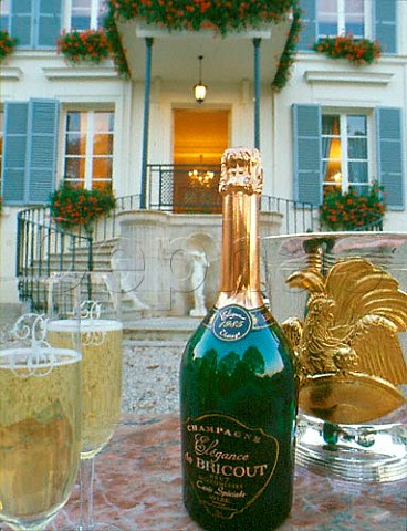 Bottle and glasses of 1985 Bricout Champagne outside   the house of Champagne Bricout Avize Marne France