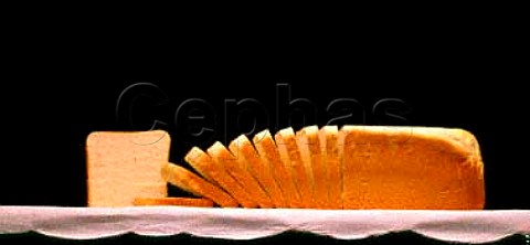 White sandwich loaf partly sliced