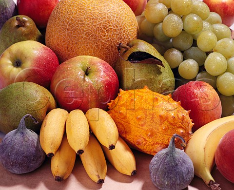 Assorted fruit  bananas melons grapes pears   peaches nectarines figs