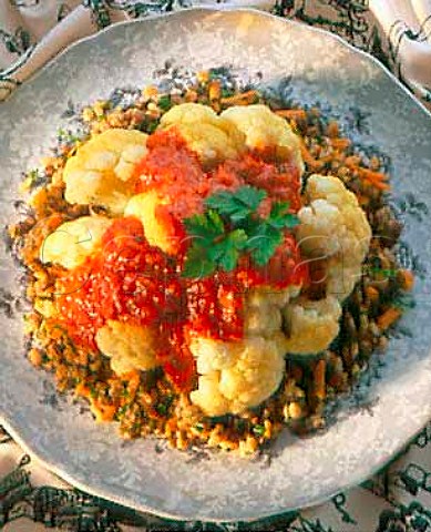 Cauliflower with tomato sauce on a bed of cooked   wheat