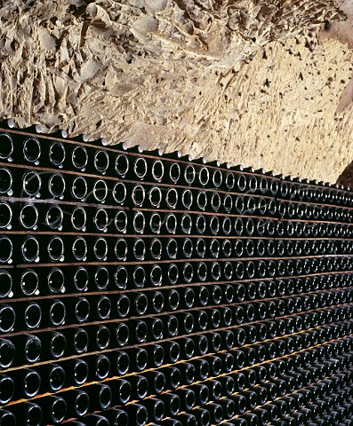 Bottles of La Grande Dame lying sur lattes in the cellars of Veuve Clicquot Ponsardin in the GalloRoman chalk quarries crayres of Reims Marne France  Champagne