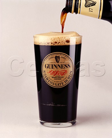 Pouring glass of Guinness