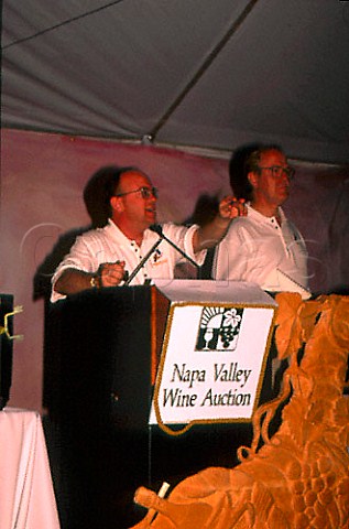 Auctioneer of Napa Valley barrel auction at St Supery winery St Helena California