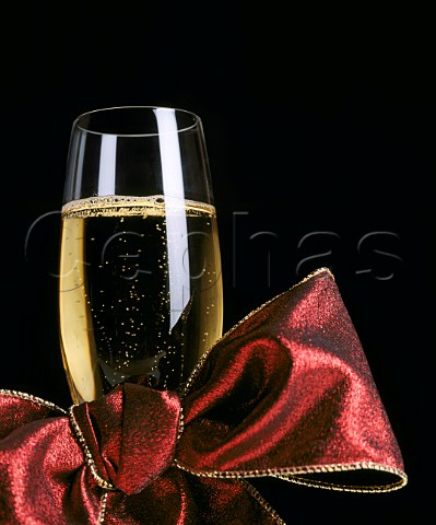 Glass of Champagne with red ribbon