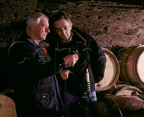 Michel Lafarge died 2020 and his son Frdric check on   the progress of their wines in barrel in their  cellars at Volnay Cte dOr France     Cte de Beaune