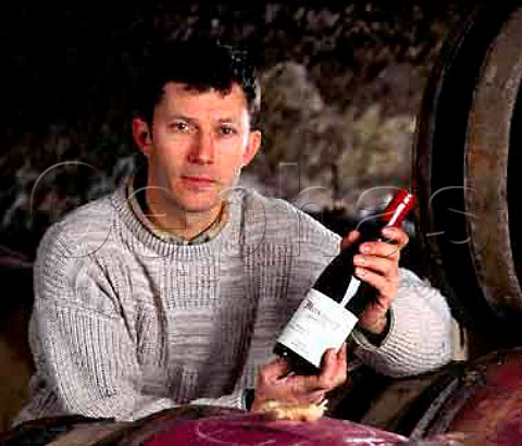 Christophe Roumier with a bottle of Musigny   in his barrel cellar  Domaine Georges Roumier   ChambolleMusigny Cte dOr France