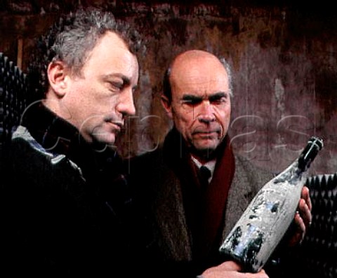 Henri Roch and Aubert de Villaine in the bottle   ageing cellar at Domaine de la RomaneConti   VosneRomane Cte dOr France