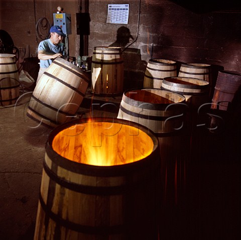 Toasting a new barrel at Tonnellerie Lasserre   Vertheuil Gironde France