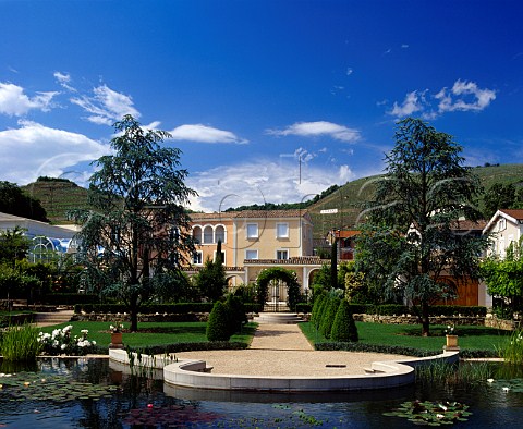 Gardens and house of Marcel Guigal with the   vineyards of the Cte Rtie beyond  Ampuis Rhne France