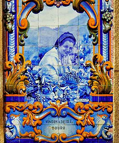 Traditional tiles azulejos depicting vineyard   scenes on the railway station at Pinhao Portugal   Port