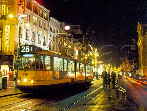 Tram in Dam Rak the main street leading from   Dam Square to the harbour front of Amsterdam  Netherlands