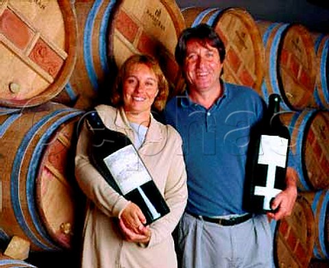 Carles Pastrana and his wife Mariona Jarque in the   cellars of Costers del Siurana with a Methuselah each   of their Clos de lObac and Miserere   Gratallops Catalonia Spain   Priorato
