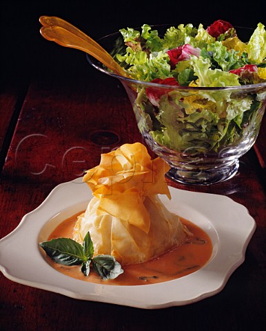 Filo pastry parcel with a green salad