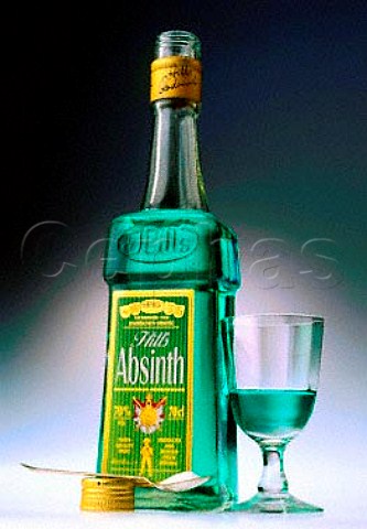Bottle and glass of Absinth with a spoon of sugar