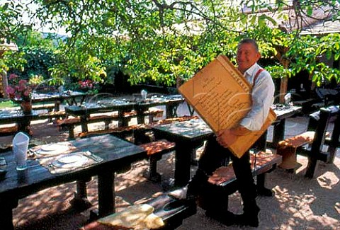 Waiter with the menu at Restaurant   Udvarhz Veszprm  Balaton Hungary