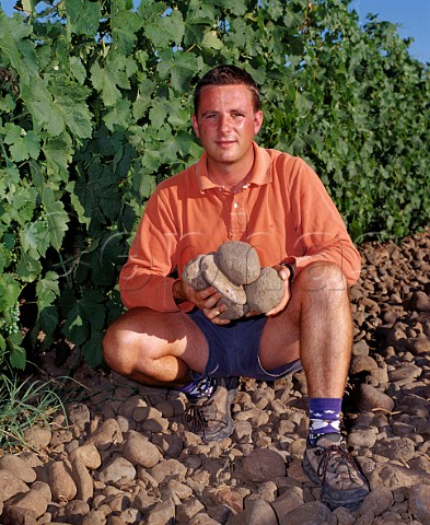 Christophe Baron of Cayuse Vineyards with the basalt cobbles which cover the ground in his Syrahplanted Cailloux vineyard  these are due to it being planted in the ancient bed of the Walla Walla River MiltonFreewater Oregon USA Walla Walla Valley AVA