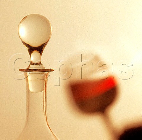 Decanter and shadow of wine glass
