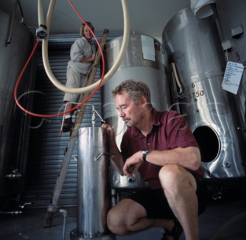 Neil McCallum filtering in the winery of   Dry River Wines Martinborough New Zealand   Wairarapa