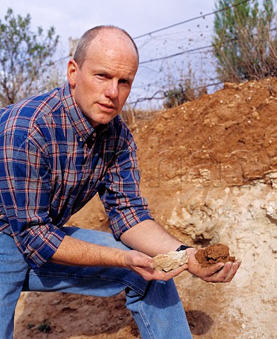 Jeff Grosset by a profile of the loam on limestone   soil which makes for the best Riesling vineyards in   the Watervale area of the Clare Valley   South Australia     Clare Valley