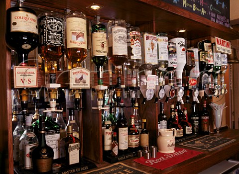 Bottles of spirits behind the bar of a typical English  pub