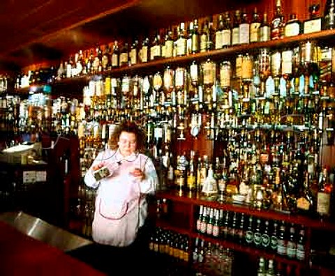 Maria McBain behind the bar of The Grouse Inn  over   800 varieties of whisky are stocked  Cabrach Moray Scotland