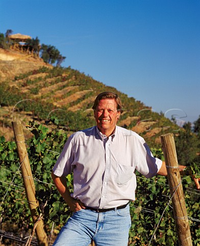 Aurelio Montes with on slope beyond his Le Folly vineyard planted with Syrah Apalta Colchagua Valley Chile        Rapel