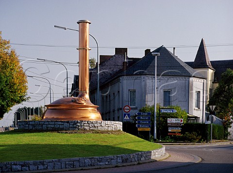 One of the old copper fermentation kettles from the  Chimay Trappist brewery on a roundabout in the town of Chimay Belgium