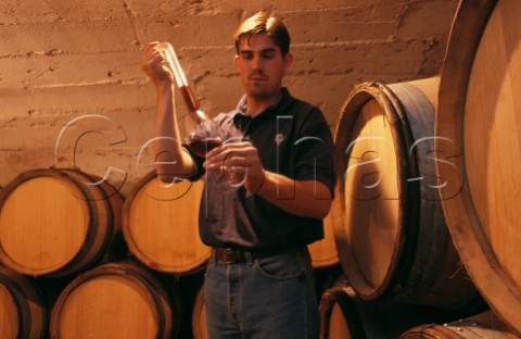 JeanLaurent Vacheron takes a sample of Pinot Noir from barrel in the cellars of   Domaine Vacheron Sancerre Cher France