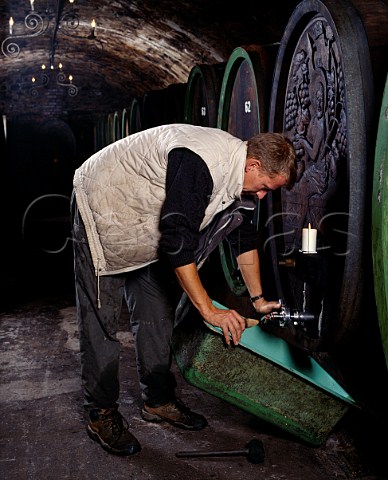 Johannes Eser preparing for racking a barrel in the   cellars of Weingut Johannishof Johannisberg   Germany    Rheingau