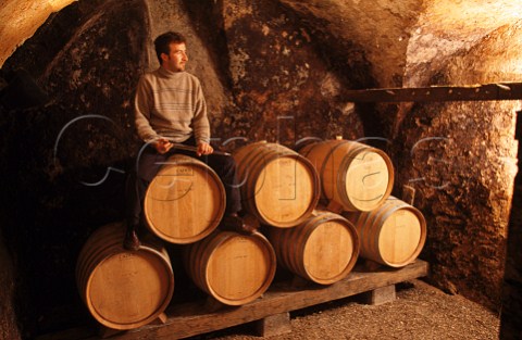 Alessandro Fanti in the barrel cellar of   Giuseppe Fanti winery  Lavis Trentino   Italy